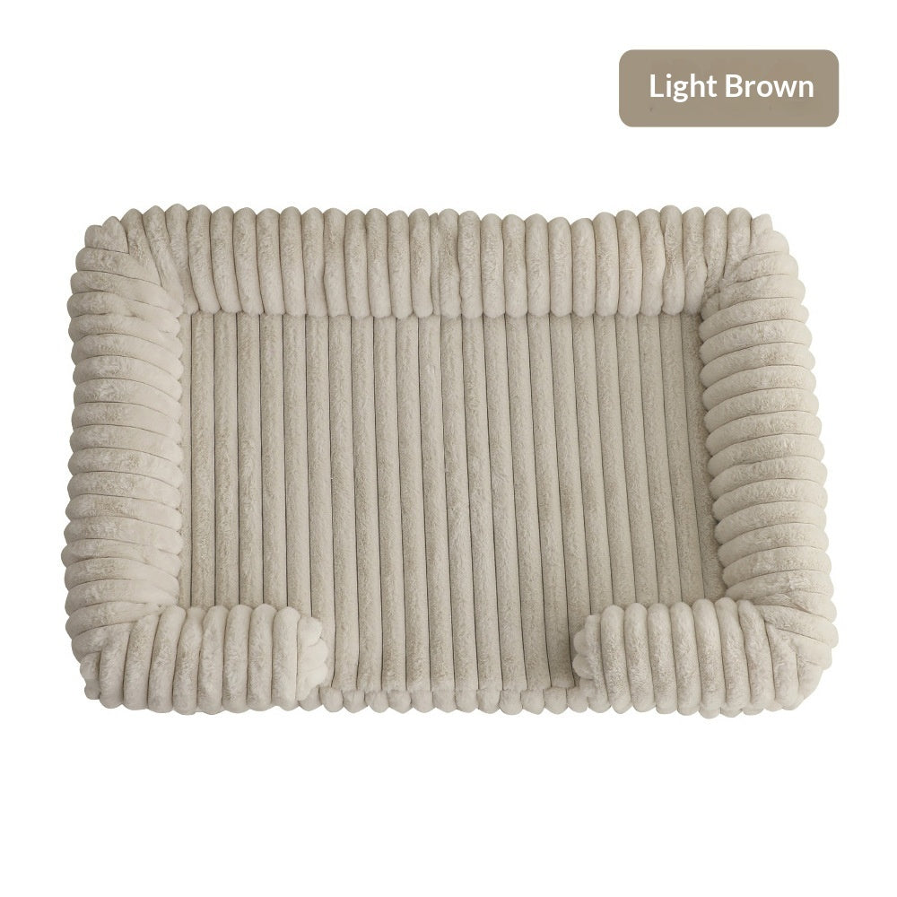 Ultra-Soft Calming Dog Bed in light brown, featuring thick cushioned walls and a plush surface for ultimate comfort.