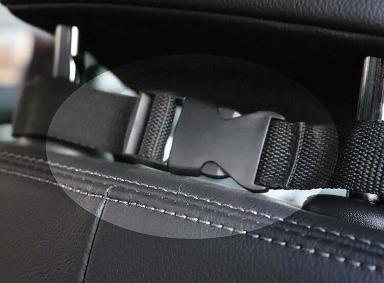 Close-up of a secure buckle on a waterproof dog car hammock seat cover, ensuring pet safety during travel.