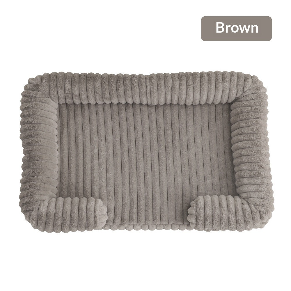 Ultra-Soft Calming Dog Bed in brown color, featuring plush surface and cushioned walls for comfort and support.