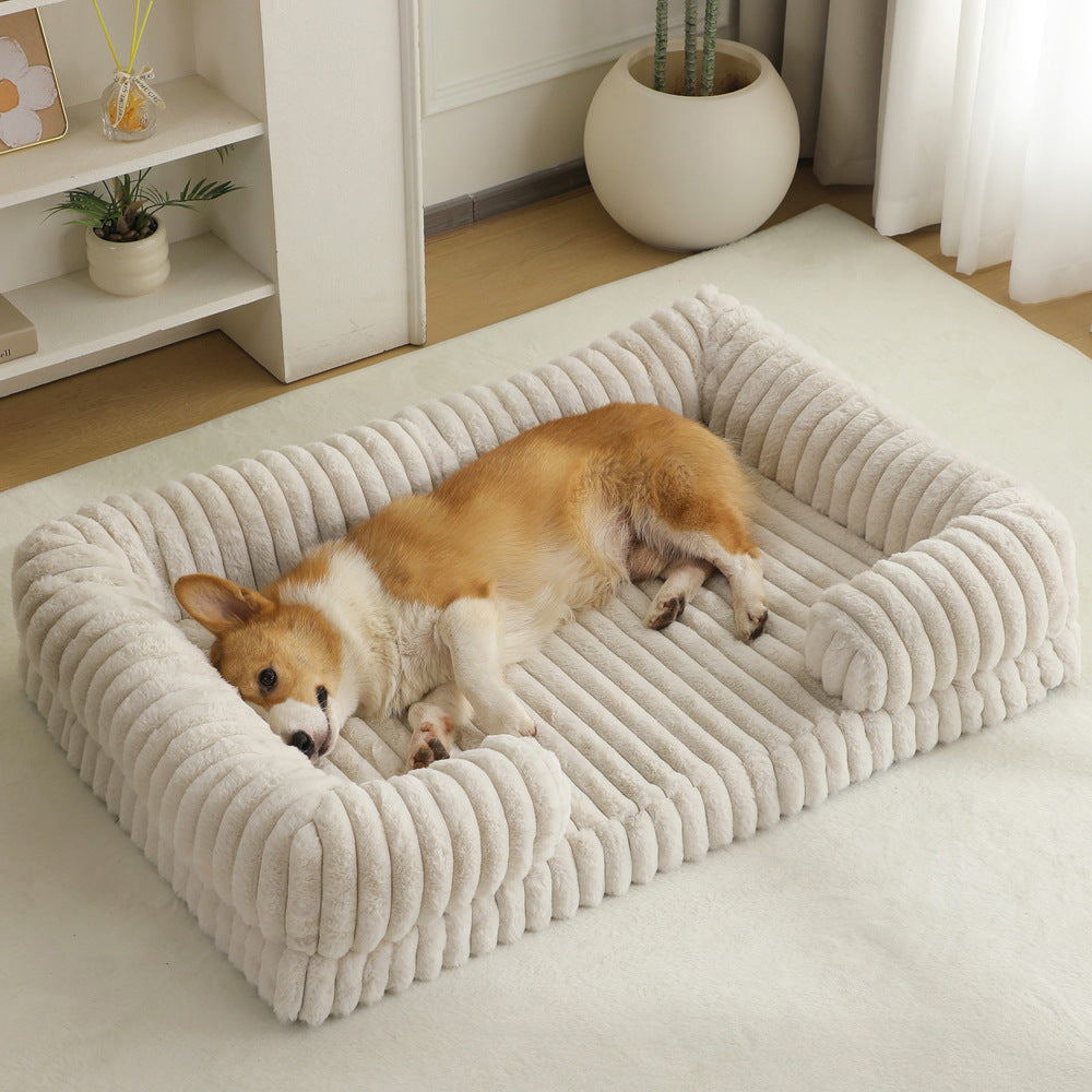 Corgi sleeping peacefully on an Ultra-Soft Calming Dog Bed featuring thick cushioned walls for support.
